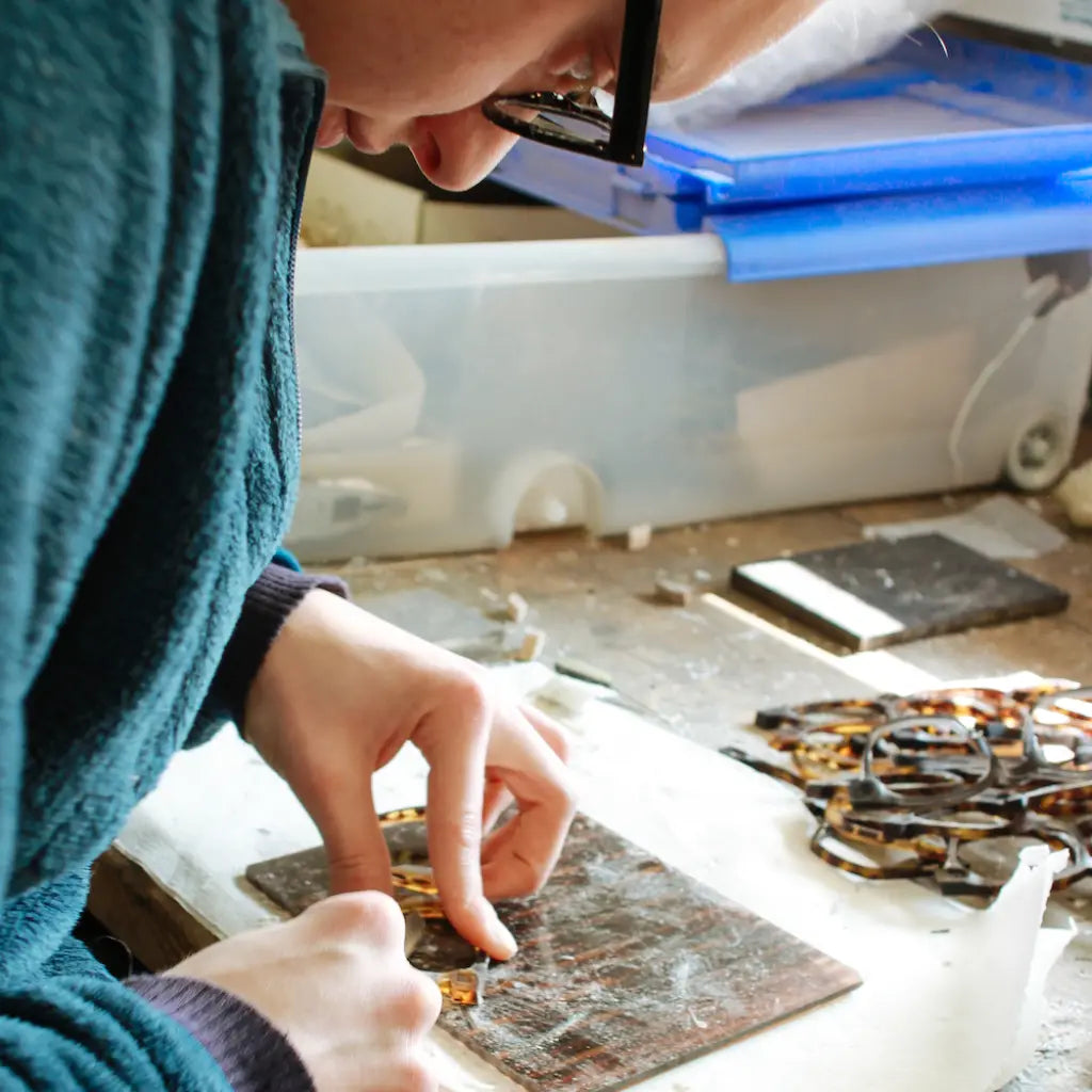 Optician repairing eyeglasses