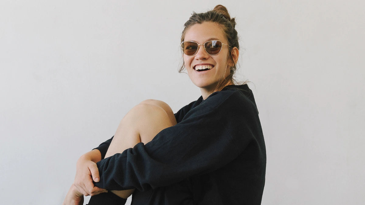 Happy model wearing Article One luxury metal eyewear from The Optical. Co