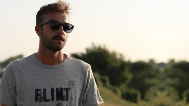 Runner wearing Article One running active performance polarized sunglasses from The Optical. Co