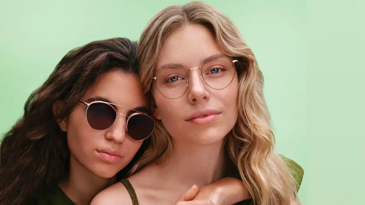 Models wearing round metal Andy Wolf eyeglasses and sunglasses from The Optical. Co