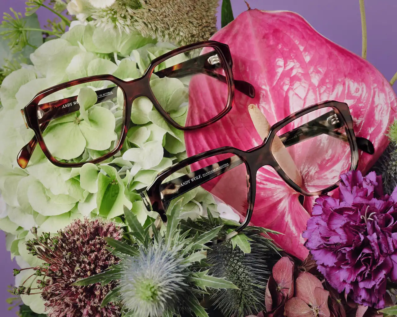 Andy Wolf luxury eyeglasses on decorative bouquet of flowers