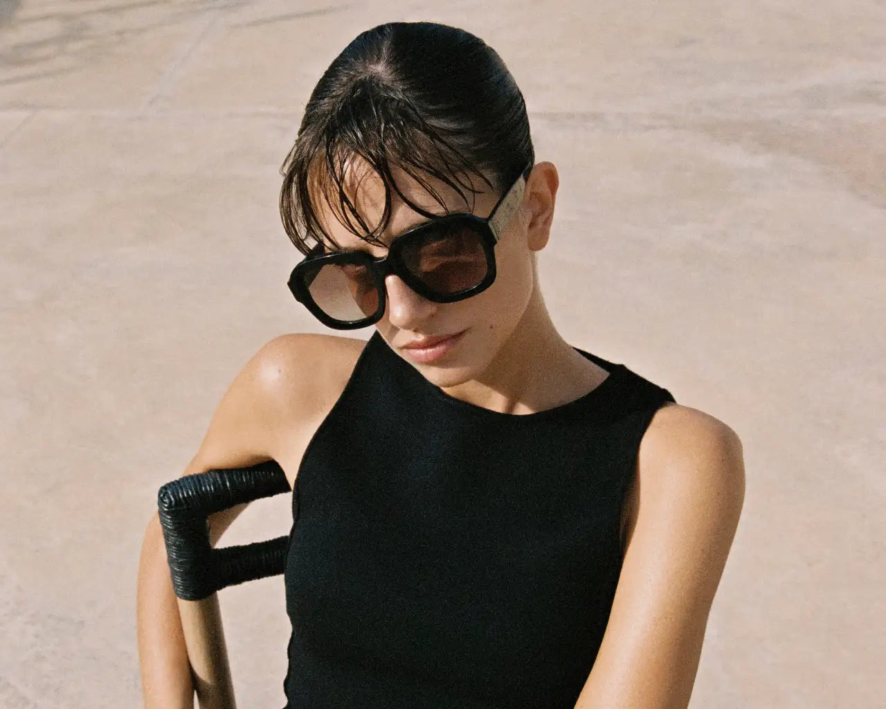 Model wearing Andy Wolf sunglass frames