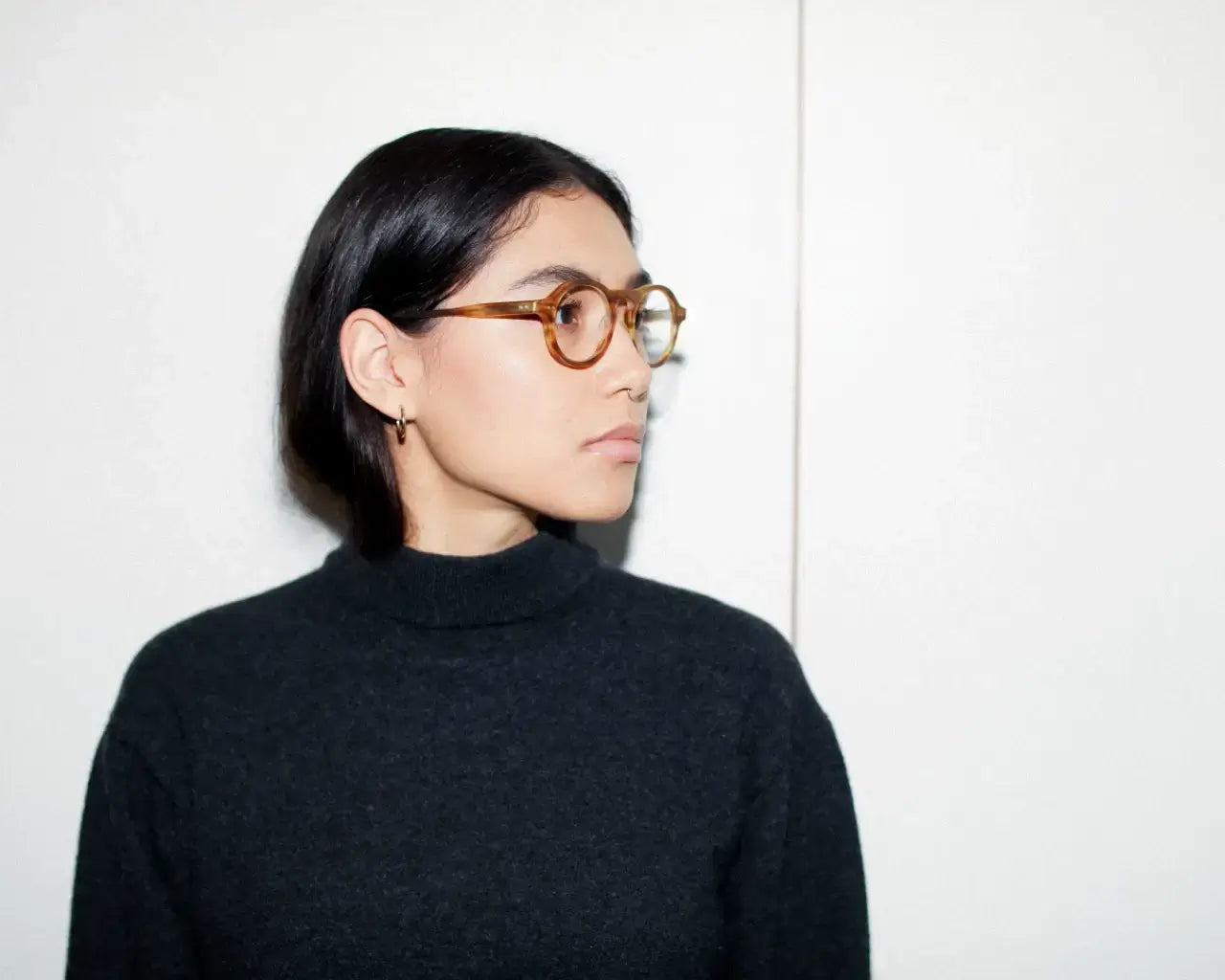 Woman wearing Edey round plastic eyeglasses by Article One
