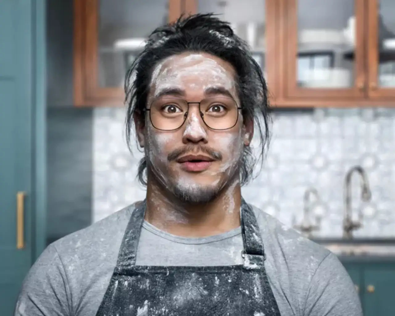 Man with clear lenses with flour on face showing clarity of Hoya eyeglass prescription lenses at The Optical Co
