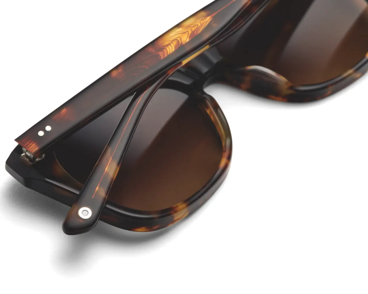 Luxury sunglasses folded sitting on table