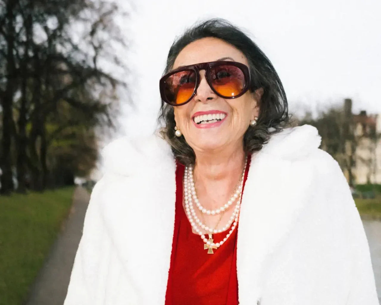 Happy woman wearing Andy Wolf sunglasses