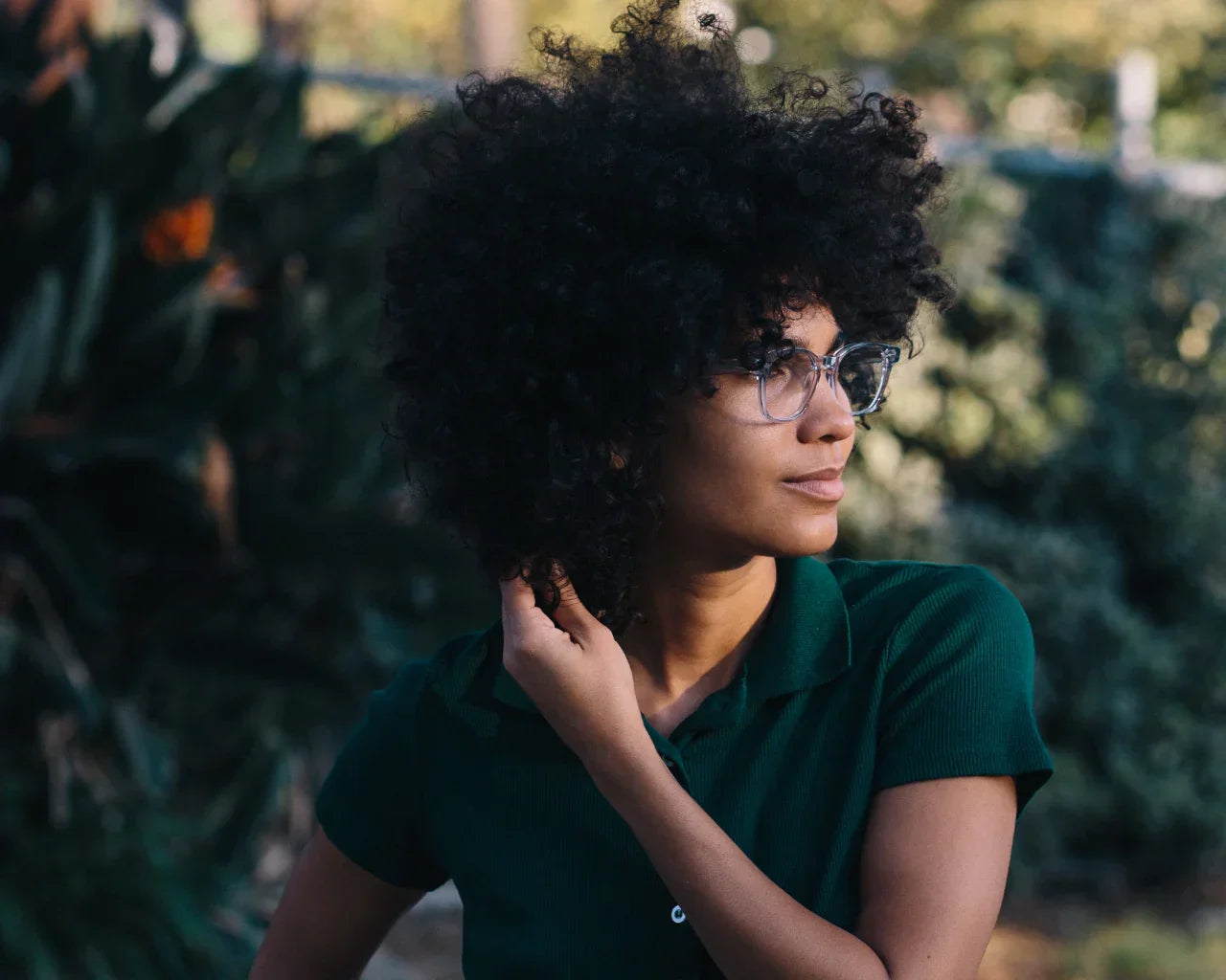 person wearing green shirt and article one glasses. Image credit: Article One
