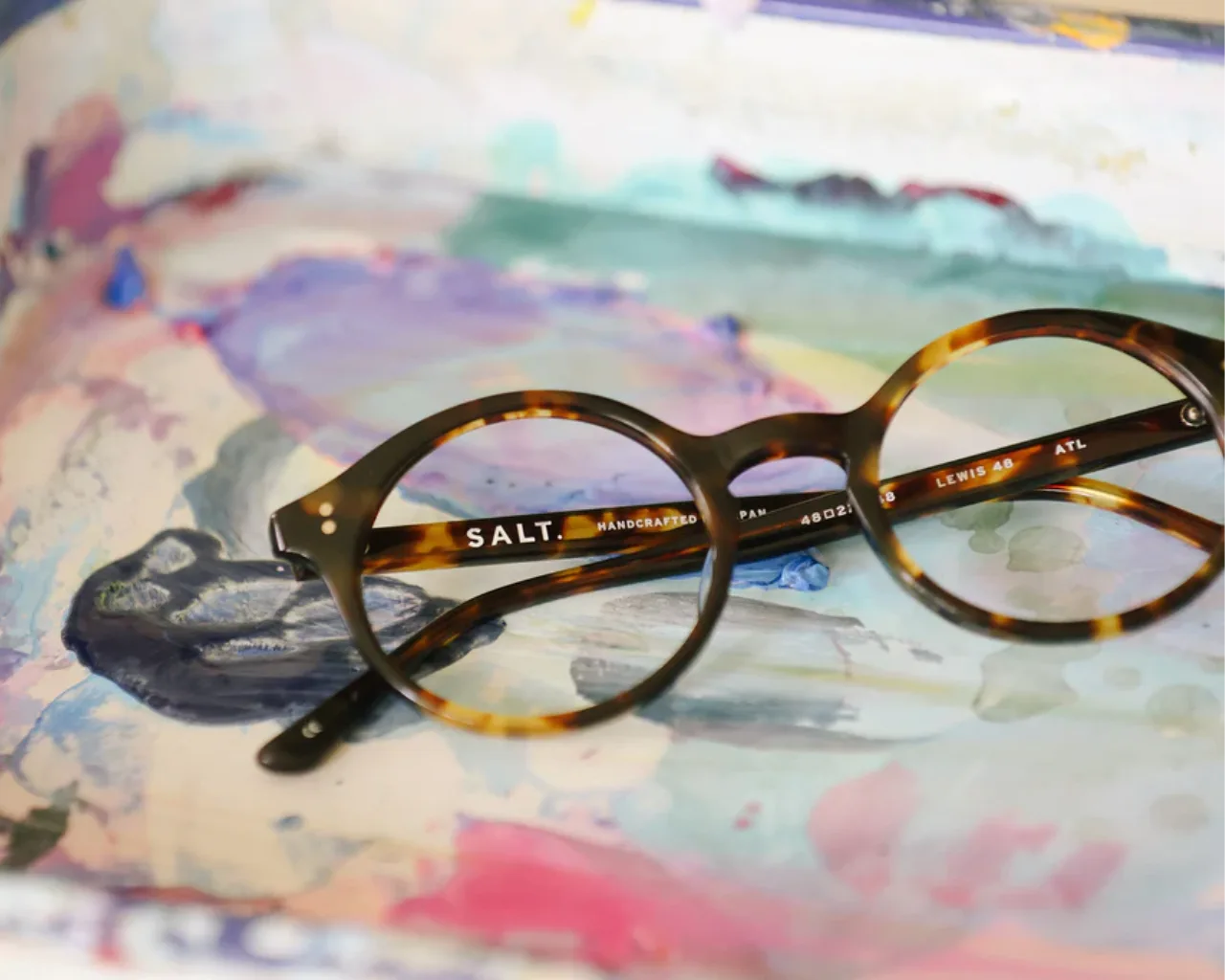 SALT round eyeglass frames on try of pastel paint colors