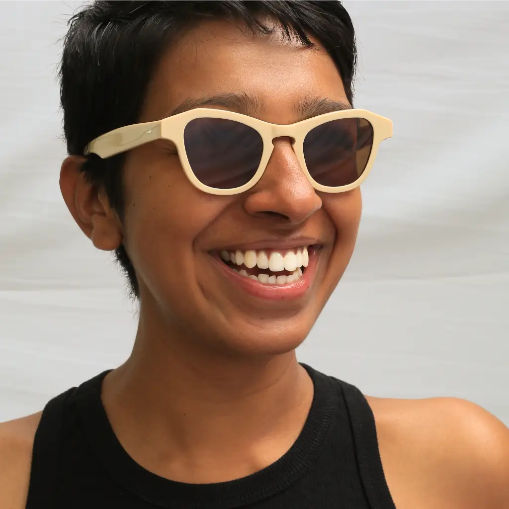 Model happy wearing Article One sunglasses