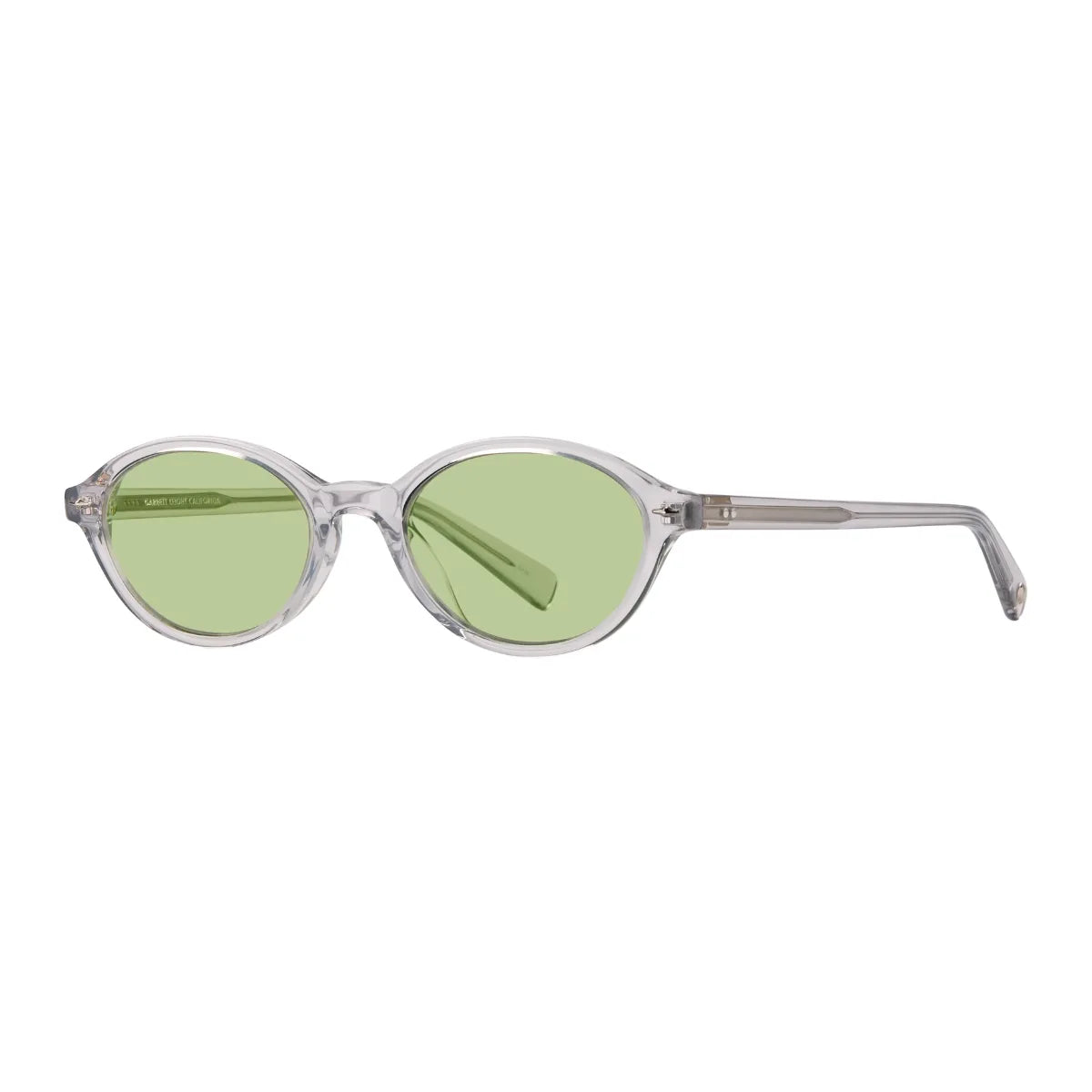Oval sunglasses with translucent clear frames and light green lenses, shown against a plain white background.