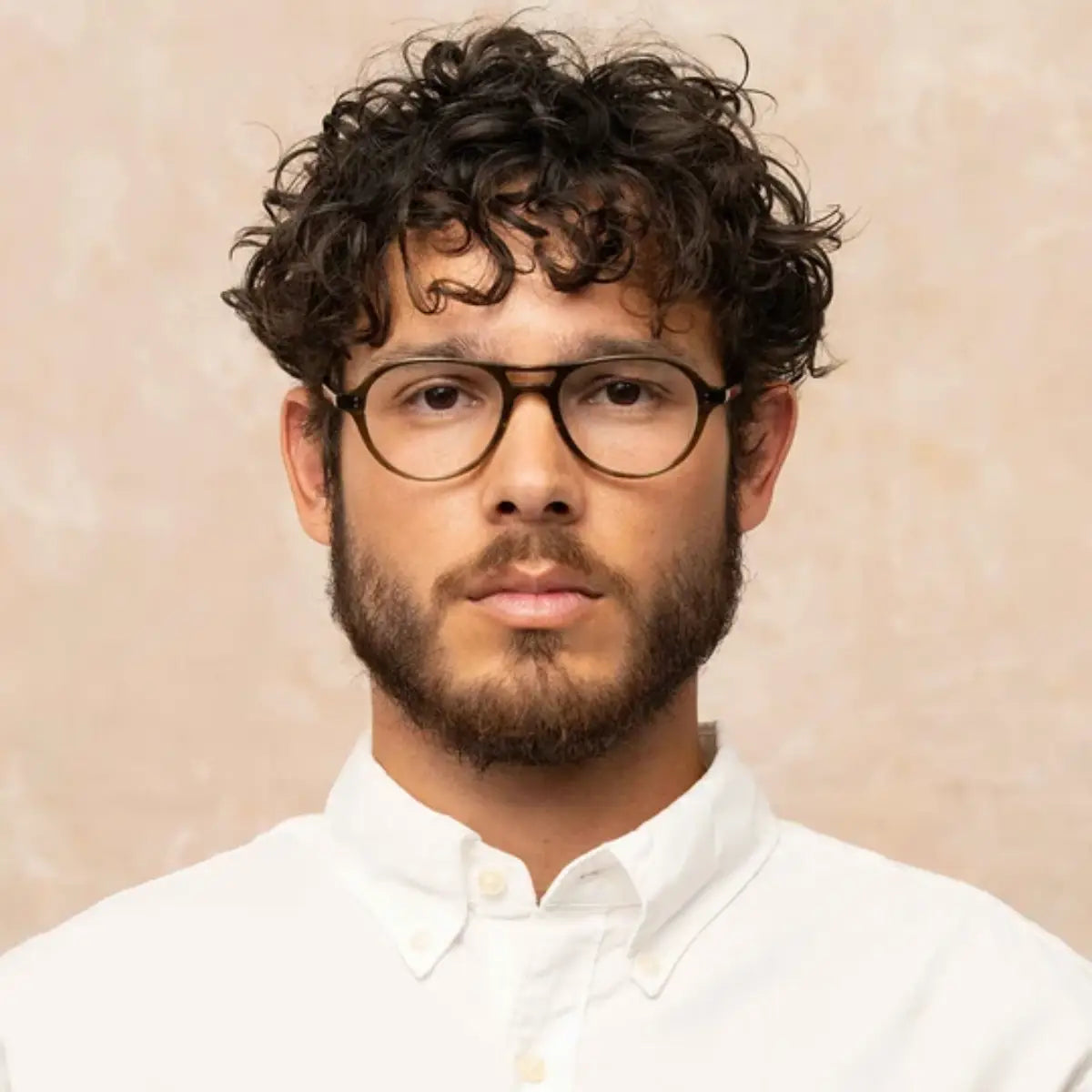 Model wearing Garrett Leight aviator round eyeglass frames 