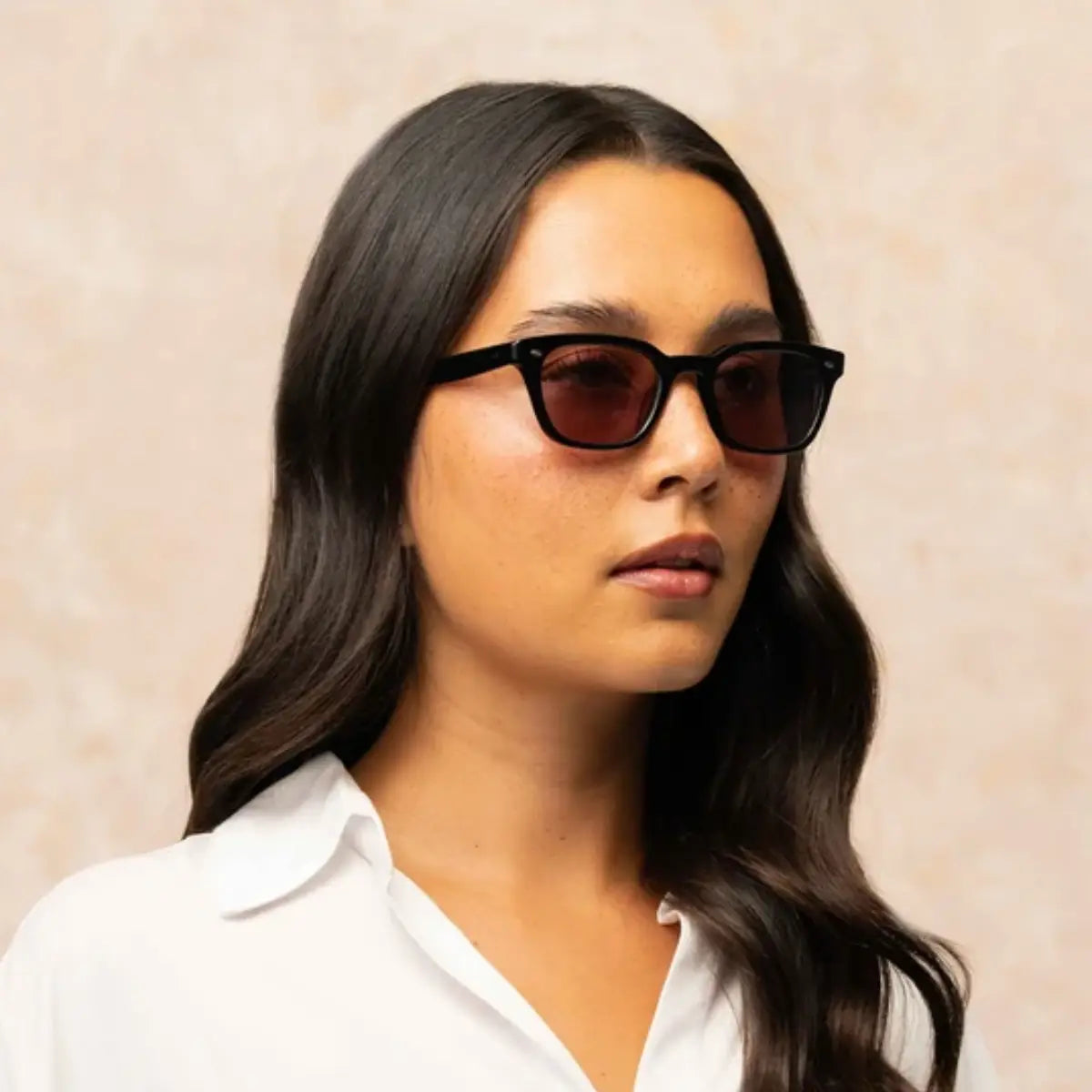 Model wearing Black narrow rectangular plastic wayfarer sunglasses by GLCO and white shirt