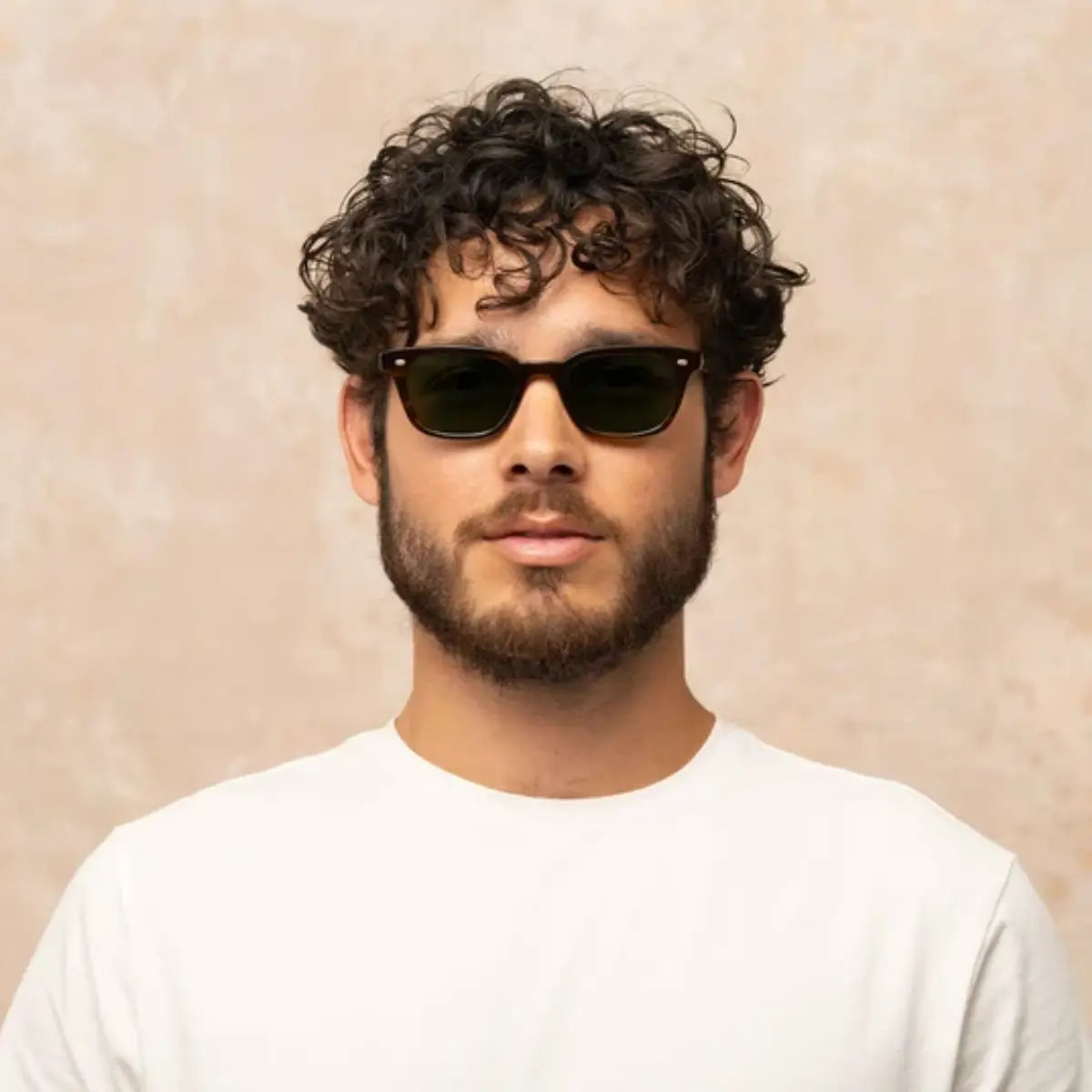 Model wearing narrow rectangular plastic wayfarer sunglasses by GLCO