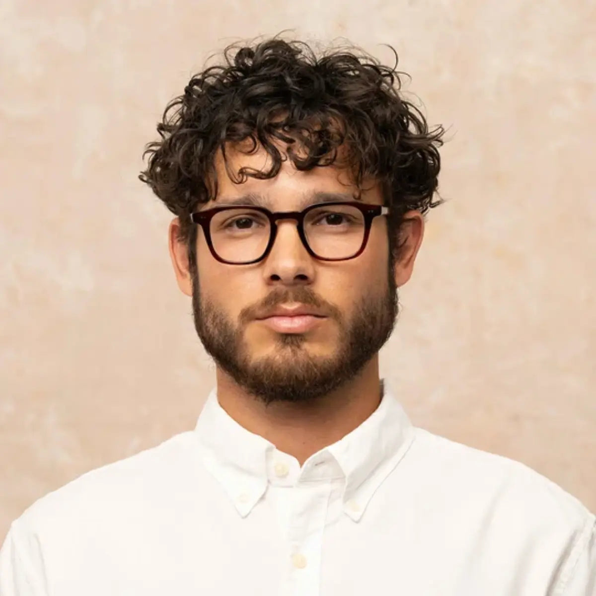 Model wearing Garrett Leight bold square plastic eyeglass frames for men and women