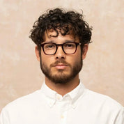 Model wearing Garrett Leight bold square plastic eyeglass frames for men and women