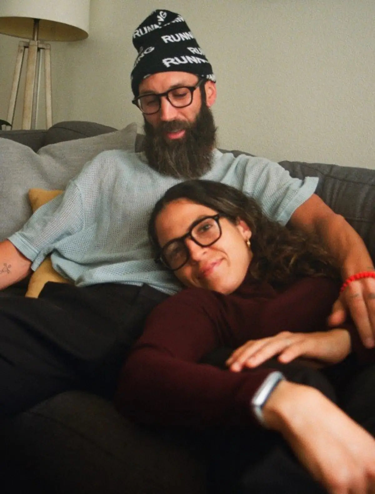 Couple on couch with Article One eyeglasses from The Optical. Co